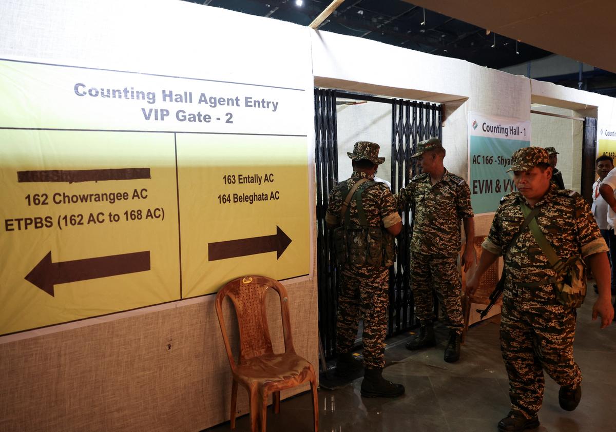 Security personnel stand guard during vote counting of the West Bengal state legislative assembly elections inside a counting centre in Kolkata, India May 4, 2026. REUTERS/Sahiba Chawdhary