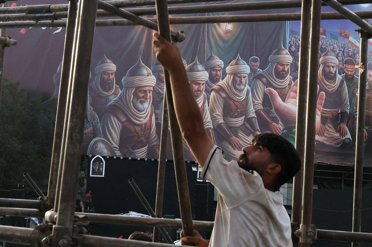A worker holds a scaffolding element during preparations for a farewell ceremony for Iran's late Supreme Leader Ayatollah Ali Khamenei at Enghelab Square in Tehran, Iran, July 2, 2026. REUTERS/Mohammed Salem  Foreign media in Iran operate under guidelines set by the Ministry of Culture and Islamic Guidance, which regulates press activity and permissions