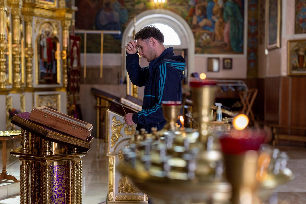 A worshipper prays at a church in Ashgabat, Turkmenistan, March 20, 2026. REUTERS/Umit Bektas