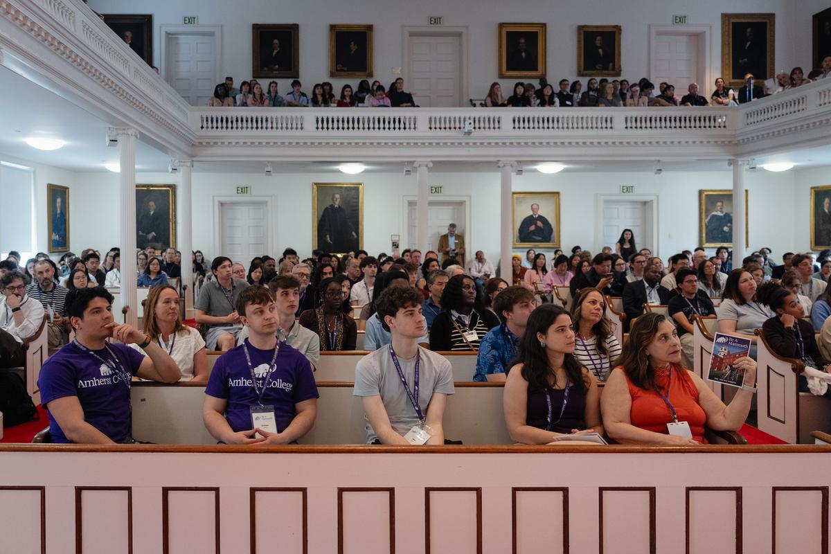  Admitted students and their families listen to the president of Amherst College, Michael Elliott, welcome them. Many of the students - including some from rural places - were weighing where to enroll for the fall. Credit: Lucy Lu for The Hechinger Report