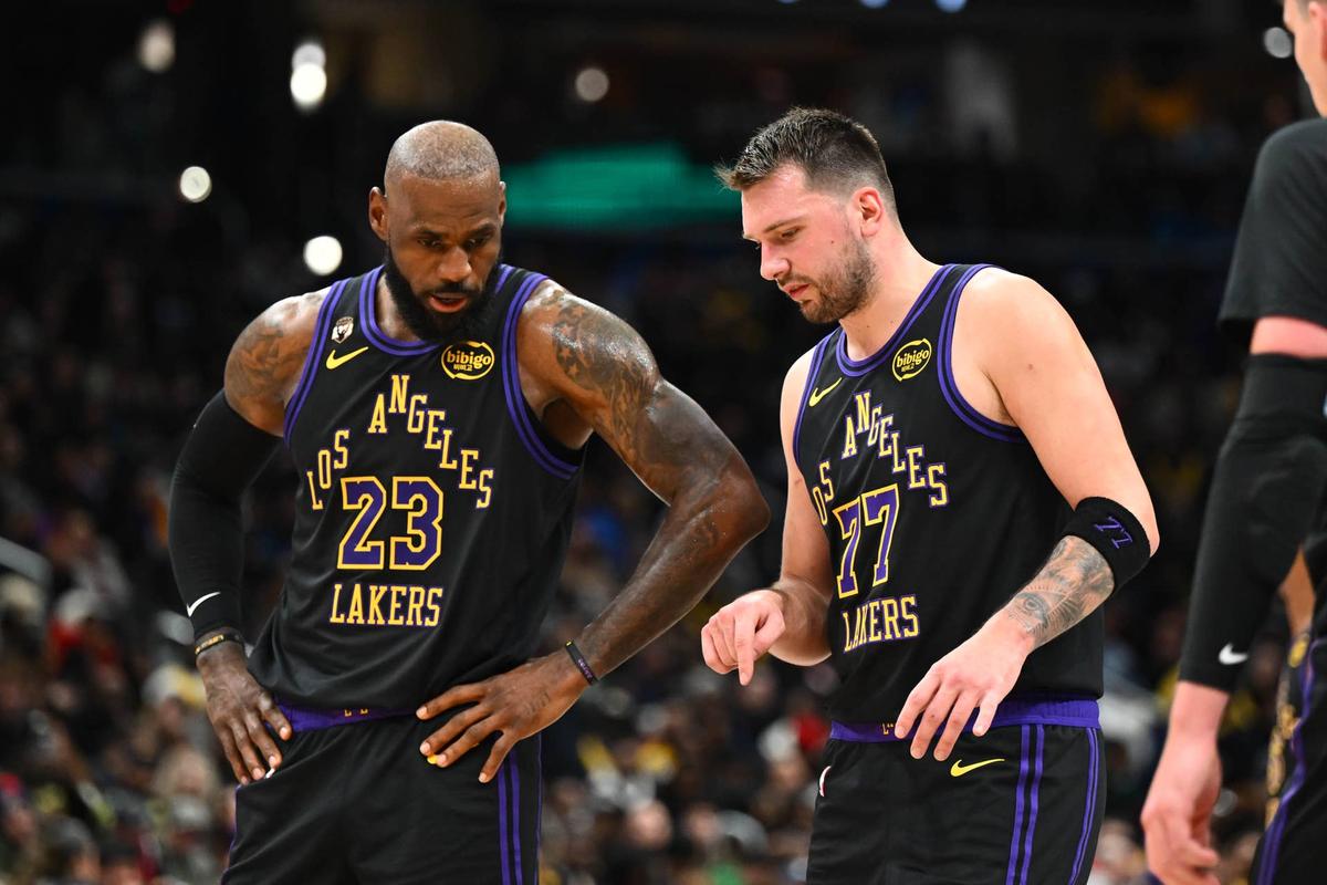 Jan 30, 2026; Washington, District of Columbia, USA; Los Angeles Lakers forward/guard Luka Doncic (77) talks with Los Angeles Lakers forward LeBron James (23) against the Washington Wizards during the second half at Capital One Arena. Mandatory Credit: Brad Mills-Imagn Images 