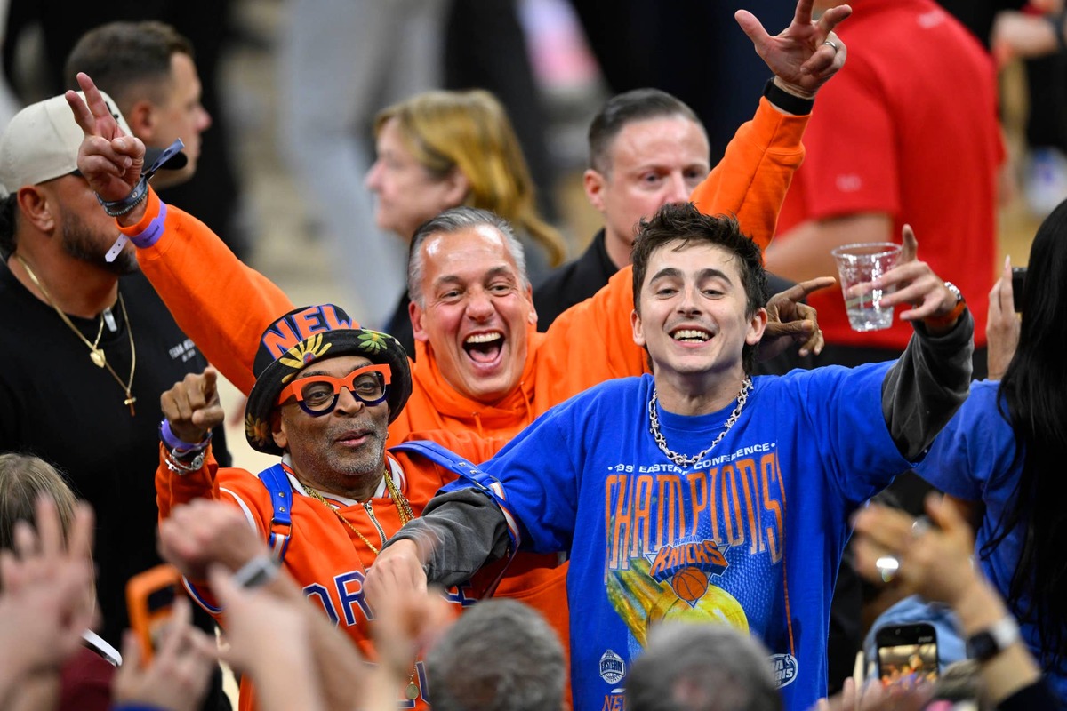  May 25, 2026; Cleveland, Ohio, USA; American filmmaker Spike Lee and actor Timothee Chalamet react after New York Knicks defeat the Cleveland Cavaliers in game four of the eastern conference finals for the 2026 NBA playoffs at Rocket Arena. Mandatory Credit: David Richard-Imagn Images 