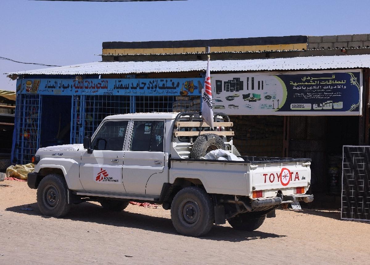 A pickup truck of the Medecins Sans Frontieres (MSF), stands in front of a market stall for solar energy equipment, in the city of Tine, eastern Chad, November 25, 2025. REUTERS/Amr Abdallah Dalsh