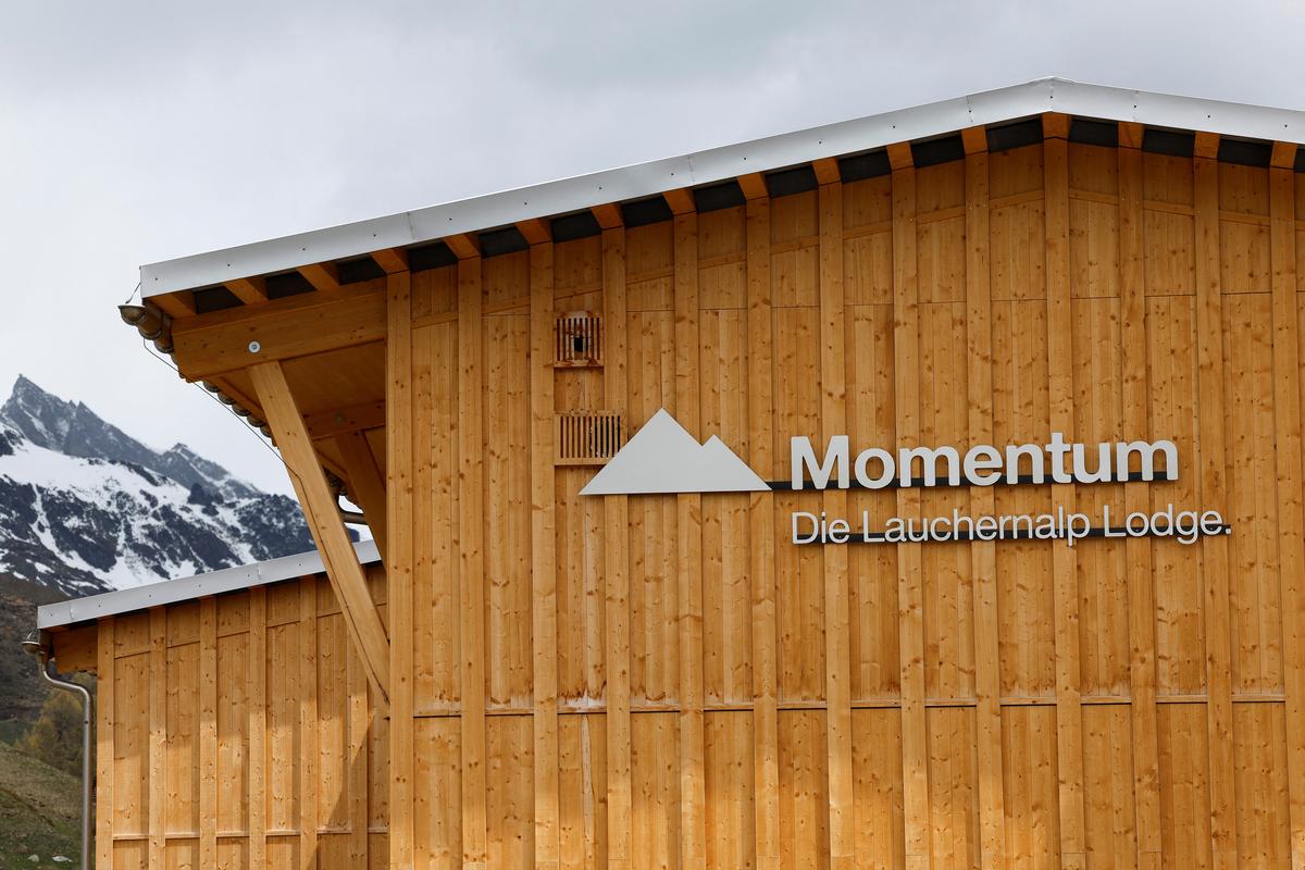 The newly built Momentum Lodge at the Lauchernalp in Wiler, overlooking the landslide area nearly a year after a massive rock and ice slide triggered by the collapse of the Birch Glacier destroyed much of the village of Blatten, Switzerland, May 20, 2026. REUTERS/Stefan Wermuth