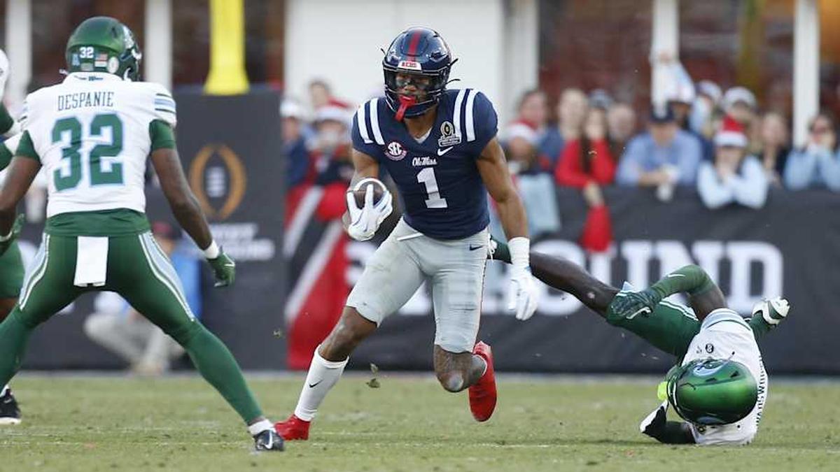  Dec 20, 2025; Oxford, MS, USA; Mississippi Rebels wide receiver De'Zhaun Stribling (1) breaks the tackle attempt by Tulane Green Wave defensive back Isaiah Wadsworth (8) during the first half of a game at Vaught-Hemingway Stadium. Mandatory Credit: Petre Thomas-Imagn Images | Petre Thomas-Imagn Images 