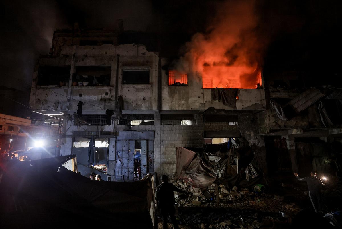 Smoke rises from a residential building following an Israeli strike, in Gaza City, May 27, 2026. REUTERS/Dawoud Abu Alkas