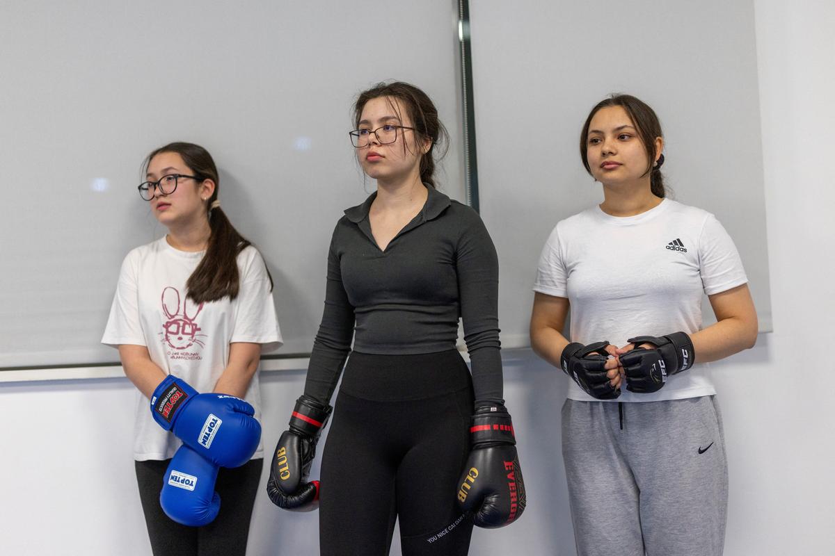 Women listen to their trainer as they practice kickboxing during a session in Ashgabat, Turkmenistan, March 19, 2026. REUTERS/Umit Bektas