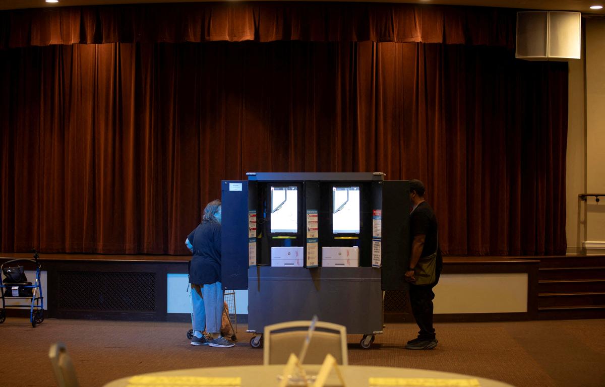 FILE PHOTO: People vote during the Georgia midterm primary election in Atlanta, Georgia, U.S. May 19, 2026.  REUTERS/Alyssa Pointer/File Photo