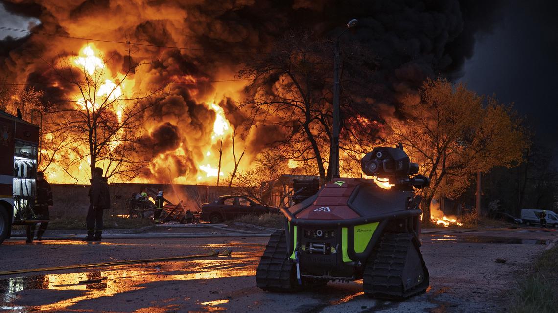 Firefighters extinguish a blaze at a recycling materials site following a Russian strike in Kyiv on April 16, 2026, amid the Russian invasion of Ukraine. Russian strikes killed at least 12 people in Ukraine, local authorities said on April 16, after Moscow pummeled its neighbor in overnight attacks. (Serhii Okunev/AFP via Getty Images/TNS)