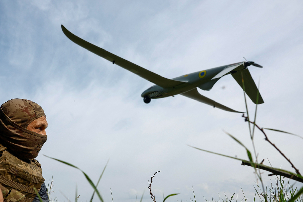 A service member of the 422nd Unmanned Systems Regiment 'Luftwaffe' of the Ukrainian Armed Forces, looks at a Shark reconnaissance drone as it launches from a position near a front line, amid Russia's attack on Ukraine, in an undisclosed location in Southern Ukraine, on an undisclosed date, 2026. REUTERS/Valentyn Ogirenko