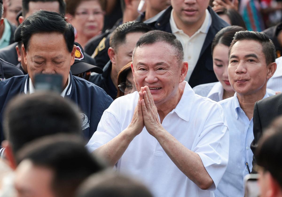 Former Thai Prime Minister Thaksin Shinawatra gestures following his release on parole after serving eight months of his one-year sentence at Klong Prem Central Prison, in Bangkok, Thailand, May 11, 2026. REUTERS/Chalinee Thirasupa
