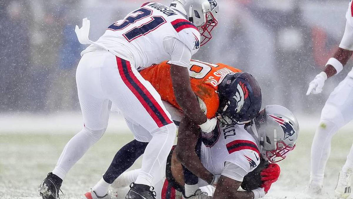  Jan 25, 2026; Denver, CO, USA; New England Patriots cornerback Christian Gonzalez (0) intercepts a pass against the Denver Broncos in the second half during the 2026 AFC Championship Game at Empower Field at Mile High. Mandatory Credit: Ron Chenoy-Imagn Images | Ron Chenoy-Imagn Images 