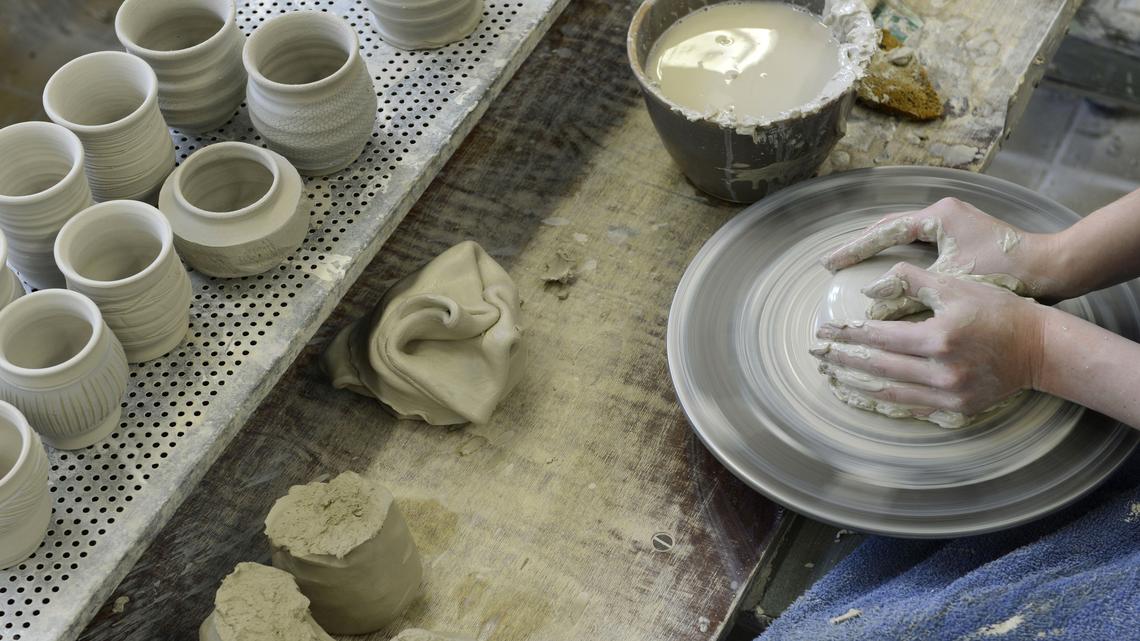 Franziska Gmeinwieser forms a vase at the ceramic school in Landshut, southern Germany, on December 7, 2012. Franziska Gmeinwieser is a schoolgirl in a school founded as royal pottery school in1873. More than 120 students per year learn here, and 40 journeymen, masters and ceramic designers finish their end. The ceramic scool in Landshut is the only school in Europe with this complete kind of education. AFP PHOTO/CHRISTOF STACHE        (Photo credit should read CHRISTOF STACHE/AFP via Getty Images)
