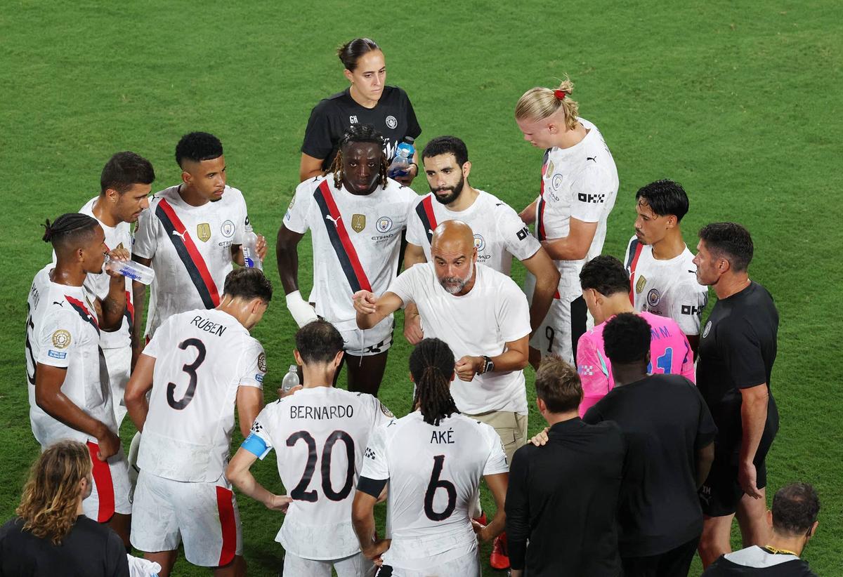  Former Manchester City manager Pep Guardiola talks to his players. Hannah Mckay-Reuters via Imagn Images