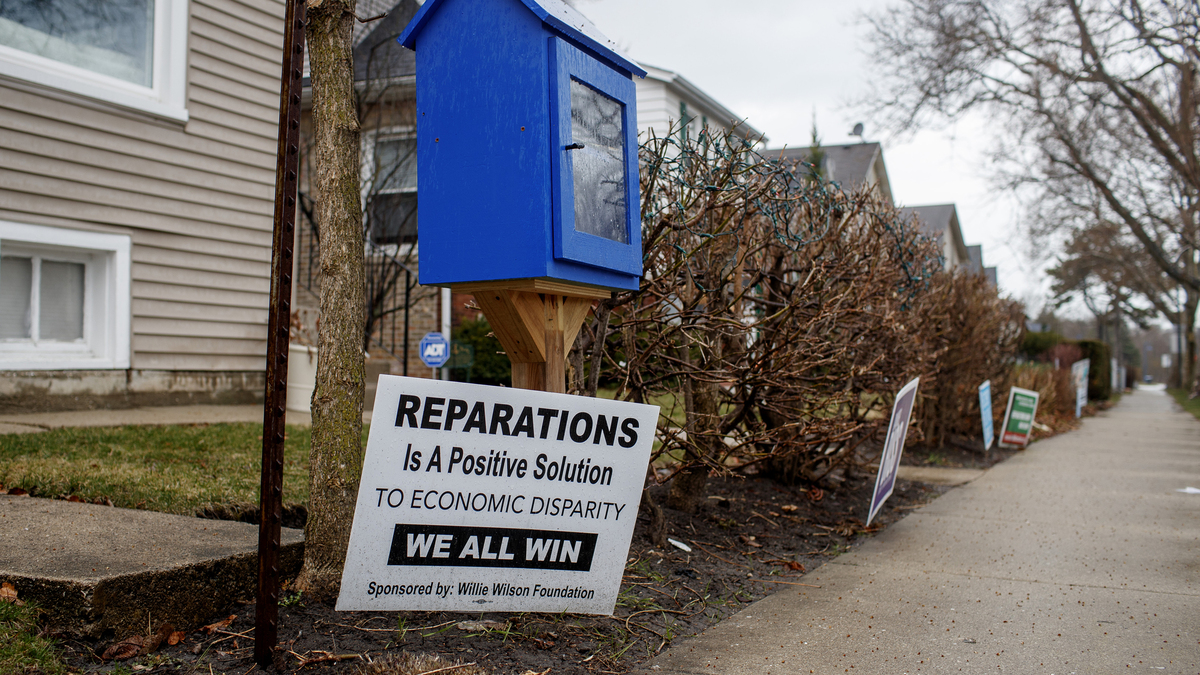 A pro-reparations sign sits outside a home in the 5th Ward Tuesday March 23, 2021 in Evanston, Ill. On Monday Evanston aldermen approved the first expenditures in the city's municipal reparations program designed to compensate Black residents for codified discrimination. (Armando L. Sanchez/ChicagoTribune/TNS)