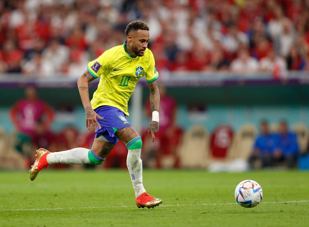  Brazil forward Neymar kicks the ball against Serbia during the 2022 World Cup at Lusail Stadium. Yukihito Taguchi-USA TODAY Sports