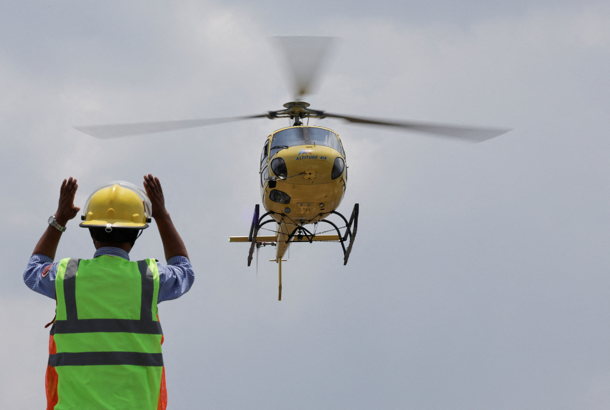 A helicopter carrying Dawa Sherpa, who was missing for several days in the Everest region, prepares to land at the helipad of HAMS Hospital in Kathmandu, Nepal, June 4, 2026. REUTERS/Navesh Chitrakar