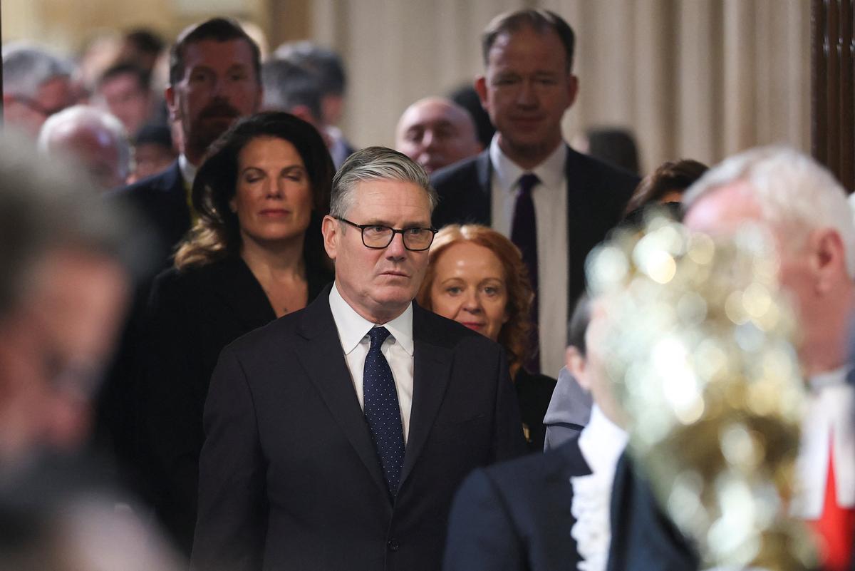 British Prime Minister Keir Starmer walks through the House of Commons to attend the State Opening of Parliament at the Palace of Westminster, London, Britain, May 13, 2026. REUTERS/Toby Melville/Pool