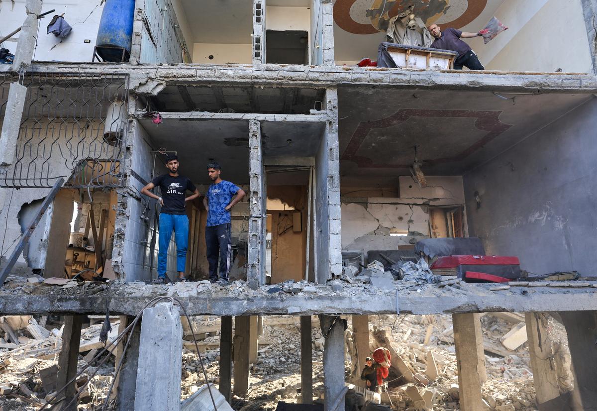 Palestinians inspect the site of an Israeli strike on a house, which was pre-warned by the Israeli military to evacuate before the strike was carried out late on Thursday, at Shati (Beach) refugee camp in Gaza City, May 29, 2026. REUTERS/Dawoud Abu Alkas