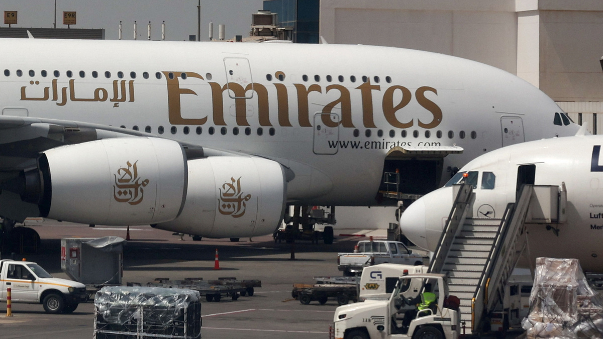 An Emirates aircraft is seen through the window of a Middle East Airlines airplane at Cairo International Airport, amid the U.S.-Israeli conflict with Iran, in Cairo, Egypt, March 31, 2026. REUTERS/Amr Abdallah Dalsh