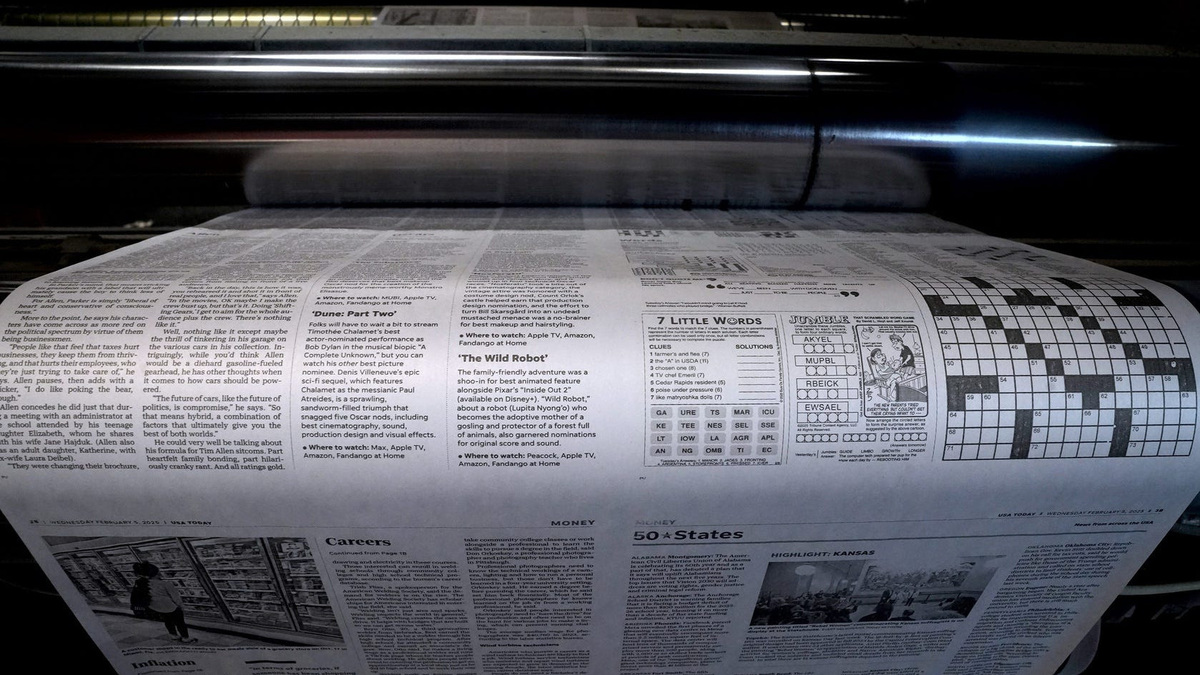 Pages run on one of the presses at The Providence Journal's former printing plant in February 2024.