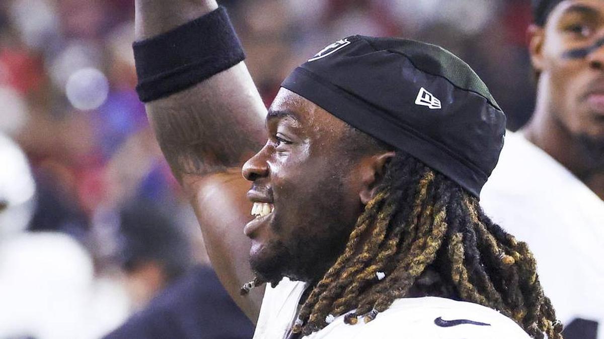  Dec 21, 2025; Houston, Texas, USA; Las Vegas Raiders running back Ashton Jeanty (2) holds a banana on the sideline after catching a touchdown pass against the Houston Texans during the third quarter at NRG Stadium. Mandatory Credit: Troy Taormina-Imagn Images | Troy Taormina-Imagn Images 