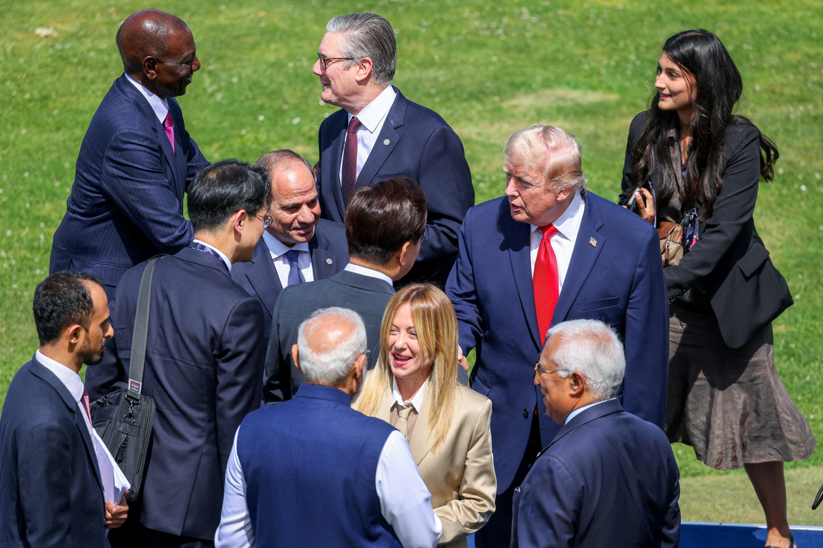 Kenyan President William Ruto, Italian Prime Minister Giorgia Meloni, UK Prime Minister Keir Starmer, Egyptian President Abdel Fattah al-Sisi, U.S. President Donald Trump, Indian Prime Minister Narendra Modi and European Council President Antonio Costa during a family photo at the G7 summit in Evian, France, on Tuesday June 16, 2026.   DOMINIQUE JACOVIDES/Pool via REUTERS
