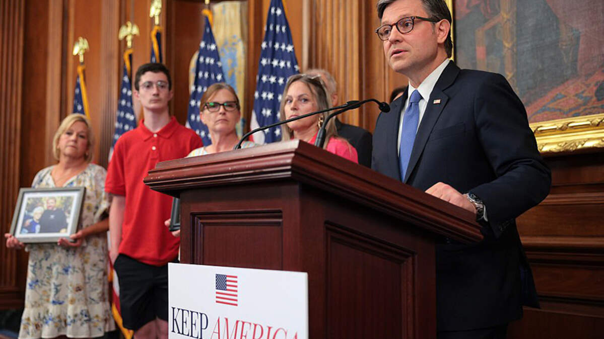 House Speaker Mike Johnson (R-La.), joined by supporters whose family members were killed by immigrants or who overdosed on drugs, holds a news conference following the passage of a $70 billion legislation to fund immigration enforcement, at the U.S. Capitol in Washington on Tuesday.