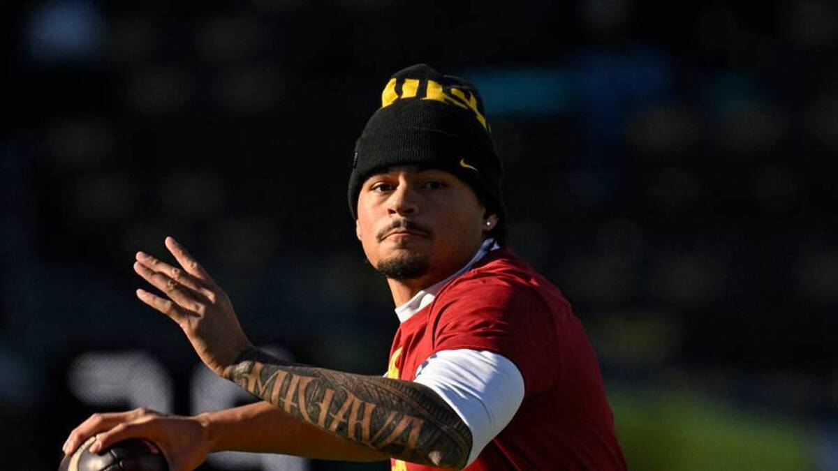  Nov 22, 2025; Eugene, Oregon, USA; Southern California Trojans quarterback Jayden Maiava (14) warms up before the game against the Oregon Ducks at Autzen Stadium. Mandatory Credit: Troy Wayrynen-Imagn Images | IMAGN IMAGES via Reuters Connect 