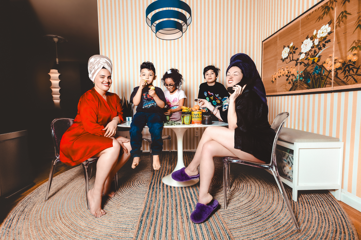  From left: Anabelle Gonzalez, Nicholas, Sophia, Marcos and Bernie Sinclaire sit at a table. 