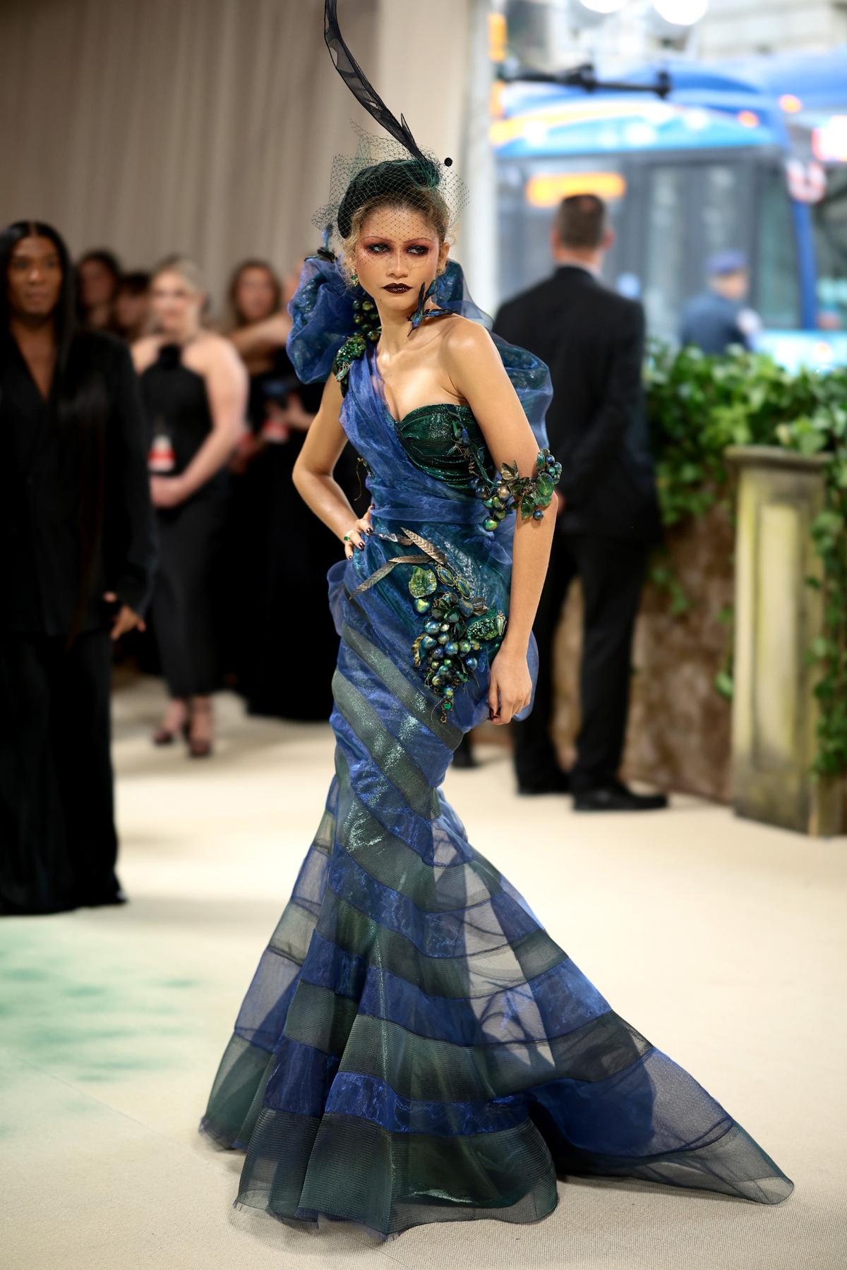 2024 Zendaya was one of the first arrivals in honor of her co-chair duties. The theme was “Sleeping Beauties: Reawakening Fashion” and the dress code was “The Garden of Time.” The Challengers star seemingly took a water approach to the theme as she looked like a wicked mermaid in a multi-layered Maison Margiela by John Galliano dress. Getty