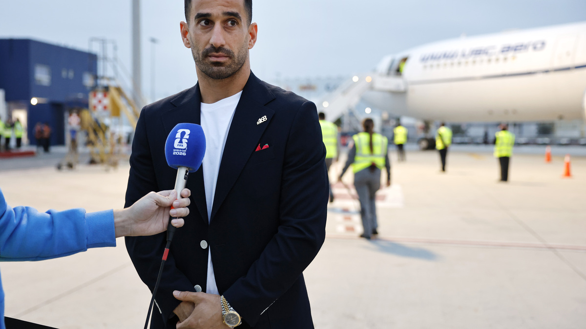 Team IR Iran Airport Arrival – FIFA World Cup 2026. TIJUANA, MEXICO - JUNE 07: Iranian national soccer team captain Ehsan Hajisafi speaks to the press after arrival at Tijuana International Airport on June 7, 2026 in Tijuana, Mexico. The team's World Cup participation has been complicated by the Iran war, with the team now training in Tijuana, Mexico, instead of Tucson, Arizona, amid ongoing U.S. visa processing issues. Iran will play its first two games across the U.S. border in Southern California against New Zealand on June 15 and against Belgium on June 21. (Photo by Mario Tama/Getty Images)