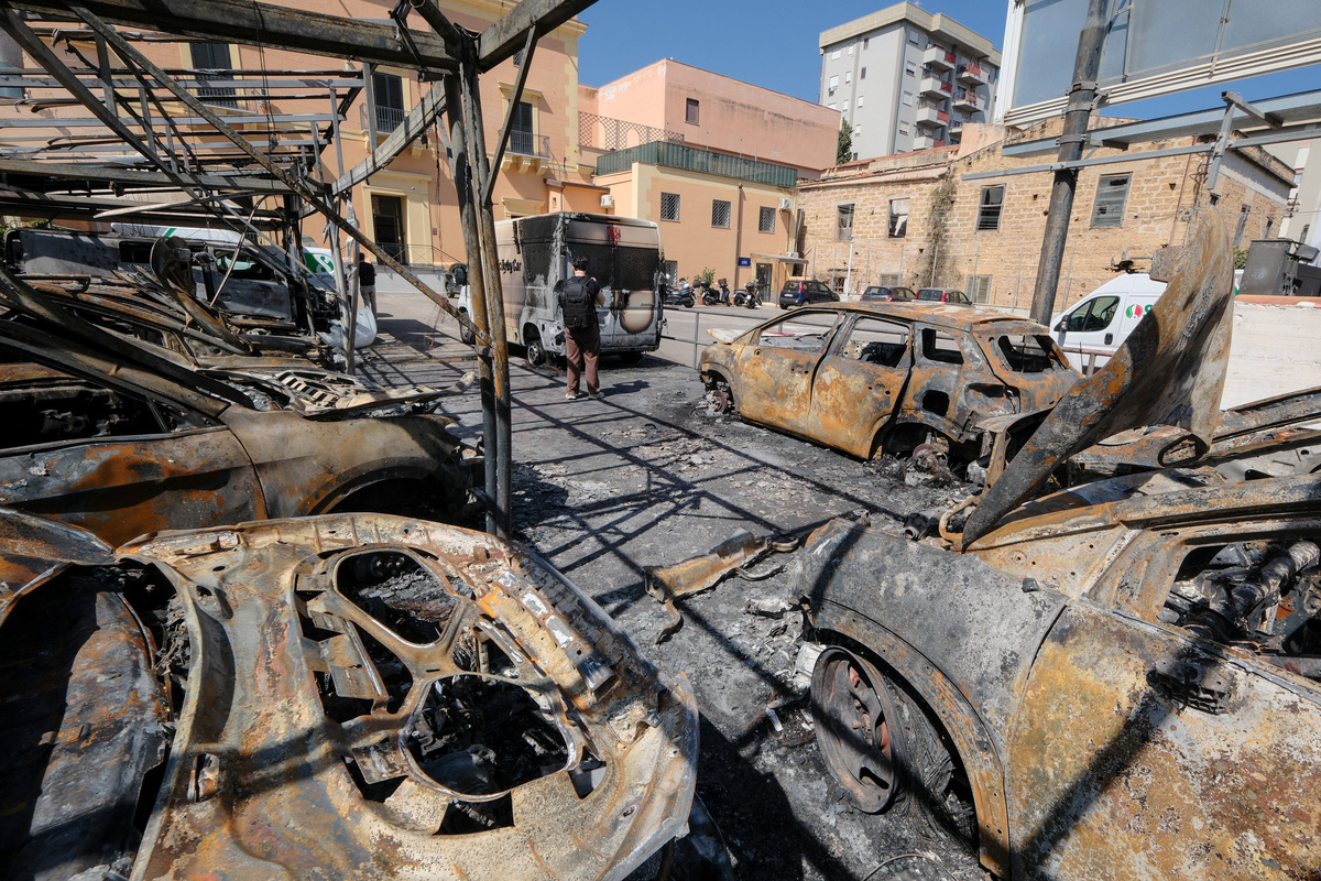 Burned vehicles sit at a depot of Italian car rental company Sicily by Car after an arson attack, in the San Lorenzo district of Palermo, Sicily, Italy, June 11, 2026. REUTERS/Igor Petyx