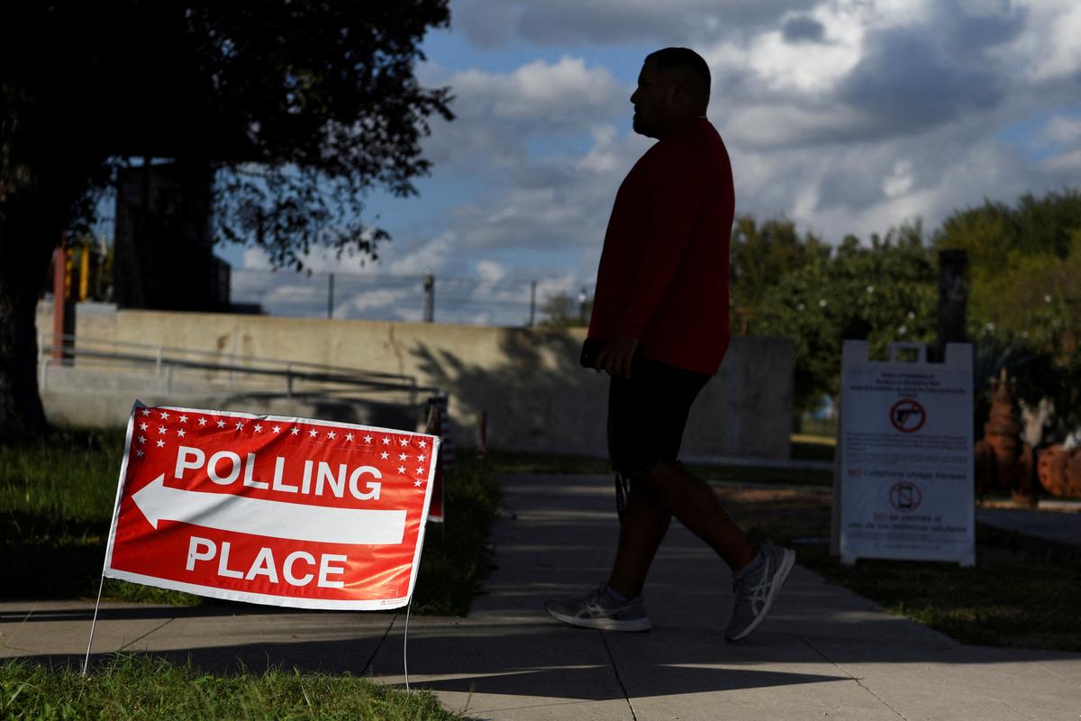 FILE PHOTO: A voter waits in line to cast their ballot during the midterm elections, in McAllen, Texas, U.S., November 8, 2022.  REUTERS/Callaghan O'Hare/File Photo