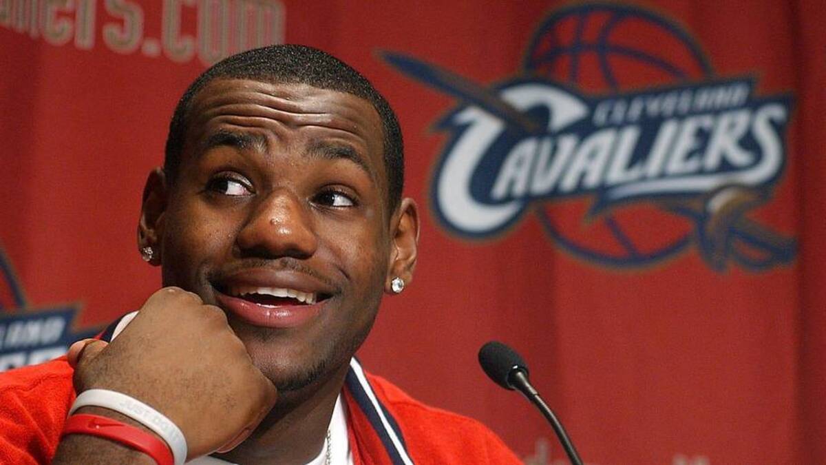  LeBron James answers questions from throng of media members gathered at Gund Arena after he worked out for former Cavaliers head coach Paul Silas and the team on June 20, 2003. | Phil Masturzo / USA TODAY NETWORK 