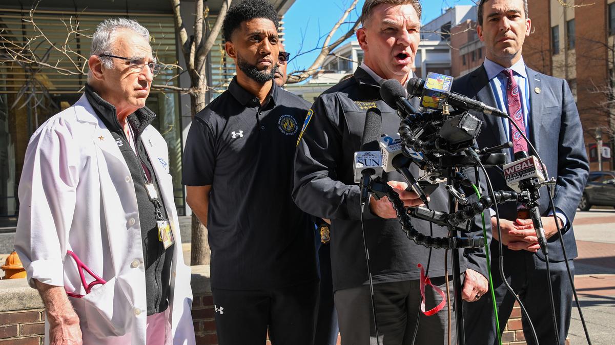 Baltimore Police Commissioner Richard Worley, center, speaks to the media during a press conference outside the Shock Trauma Center as, from left, Dr. Thomas Scalea, chief of the Shock Trauma Center, Baltimore Mayor Brandon Scott and Baltimore City Council President Zeke Cohen stand behind him, March 10, 2026. (Kevin Richardson/The Baltimore Sun/TNS)