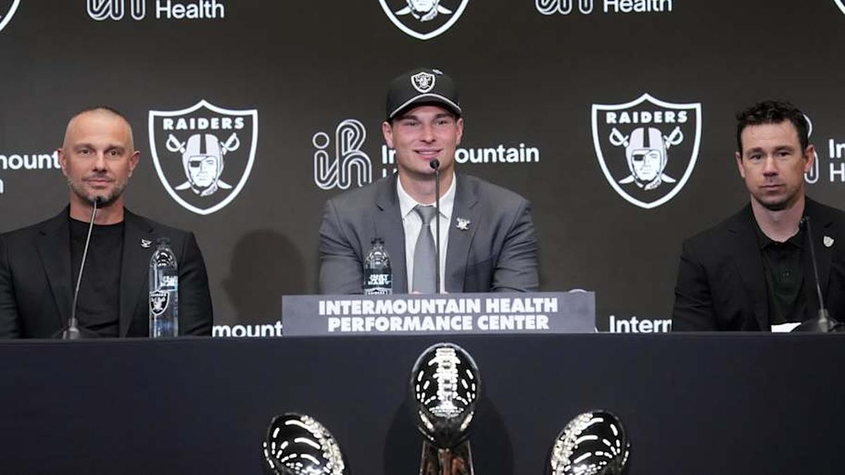 Apr 24, 2026; Henderson, NV, USA; Las Vegas Raiders quarterback Fernando Mendoza (center) speaks at introductory press conference at Intermountain Health Performance Center flanked by general manager John Spytek (left) and head coach Klint Kubiak after being selected as the No. 1 pick in the 2026 NFL Draft. Mandatory Credit: Kirby Lee-Imagn Images | Kirby Lee-Imagn Images 