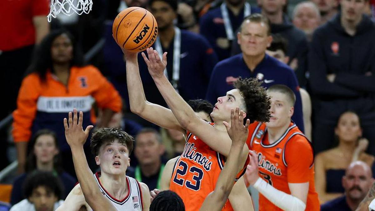  Apr 4, 2026; Indianapolis, IN, USA; Illinois Fighting Illini guard Keaton Wagler (23) goes to the basket against UConn Huskies guard Silas Demary Jr. (2) in the second half during a semifinal of the Final Four of the men's 2026 NCAA Tournament at Lucas Oil Stadium. Mandatory Credit: Trevor Ruszkowski-Imagn Images | Trevor Ruszkowski-Imagn Images 
