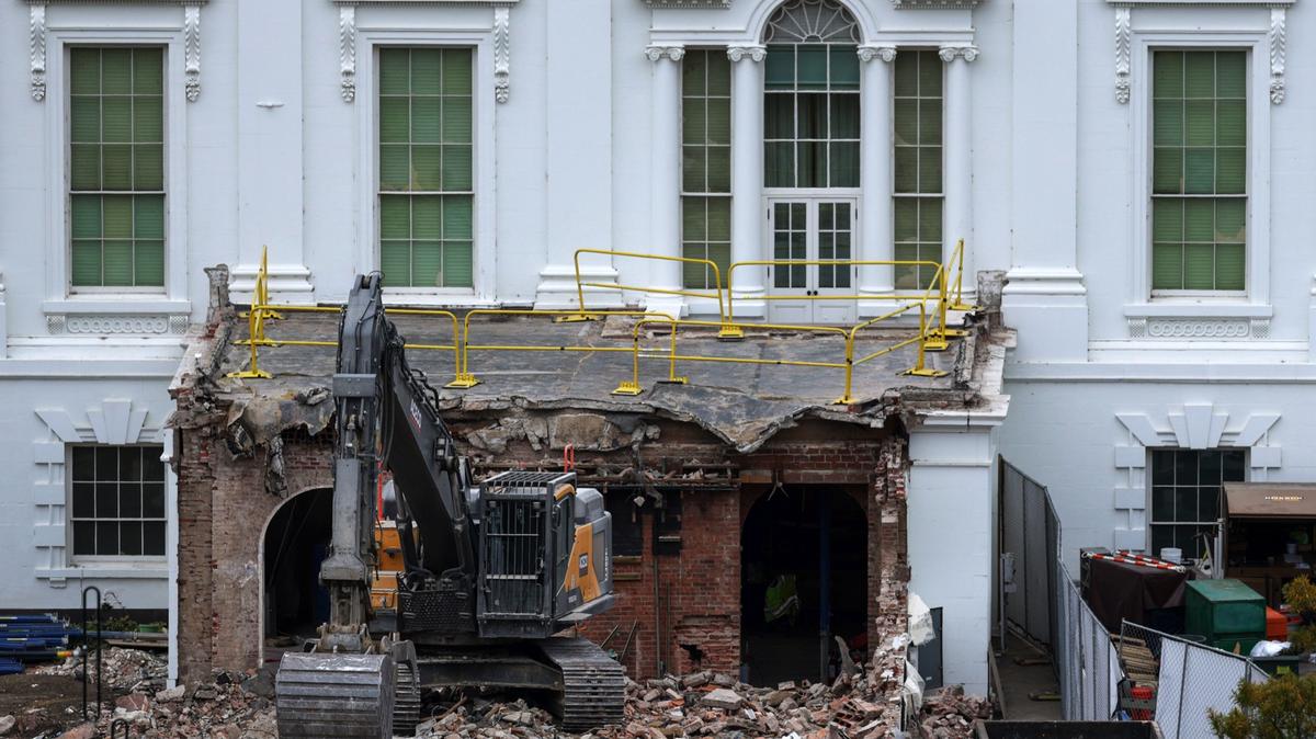 An excavator sits on the rubble after the East Wing of the White House was demolished on October 28, 2025 in Washington, DC. 