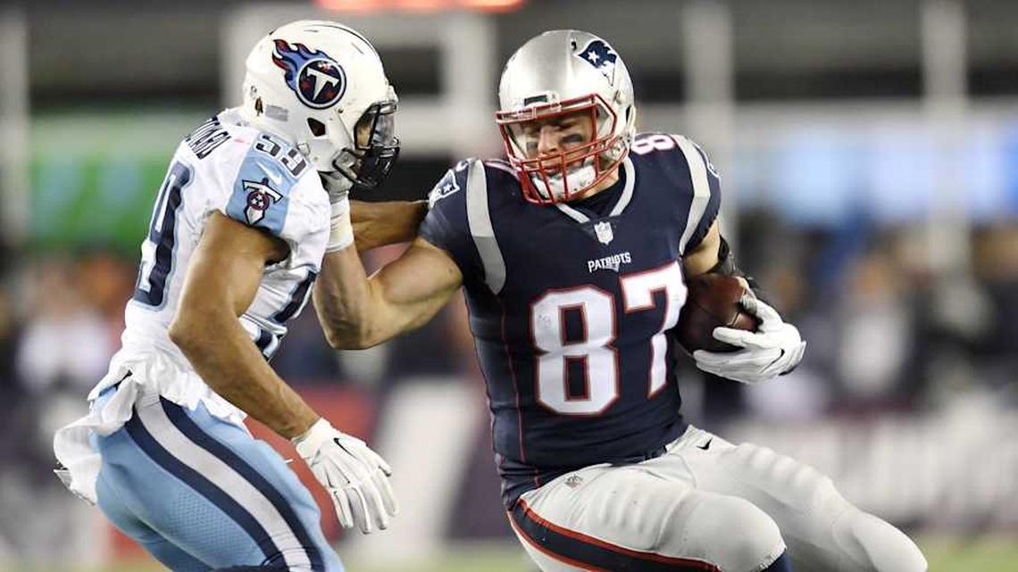 New England Patriots tight end Rob Gronkowski (87) attempts to push off Tennessee Titans linebacker Wesley Woodyard (59) after a big gain during the AFC Divisional Round playoff game at Gillette Stadium in Foxborough, Mass., Jan. 13, 2018. | George Walker IV / Tennessean.com / USA TODAY NETWORK 