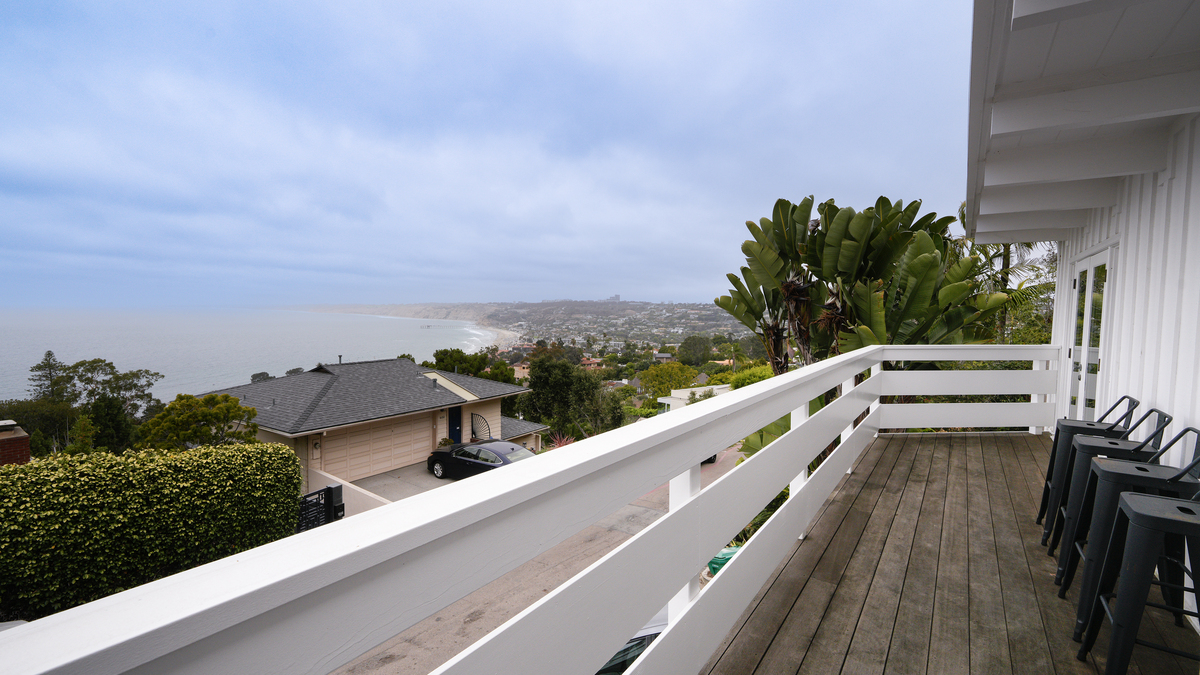 An outdoor deck located on the second level of the home, adjacent to the living room and dining area, at 1641 Crespo Drive. (Nelvin C. Cepeda / The San Diego Union-Tribune)