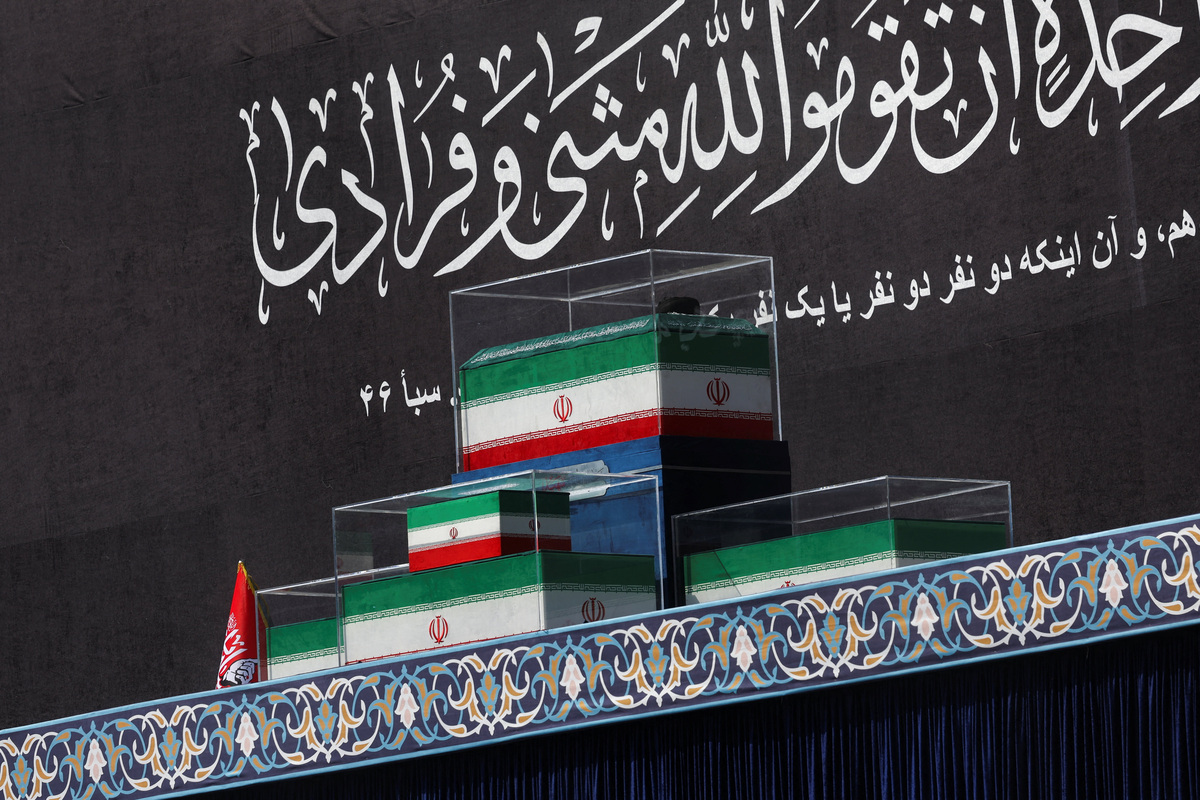 The coffins of Iran's late Supreme Leader Ayatollah Ali Khamenei and his family members in the colours of Iranian flags on the stage, as people gather for a public farewell ceremony to pay their respects to late Supreme Leader Ayatollah Ali Khamenei, who was killed on February 28 in Israeli and U.S. airstrikes, at the Imam Khomeini Grand Mosalla, in Tehran, Iran July 4, 2026.  REUTERS/Murad Sezer  Foreign media in Iran operate under guidelines set by the Ministry of Culture and Islamic Guidance, which regulates press activity and permissions