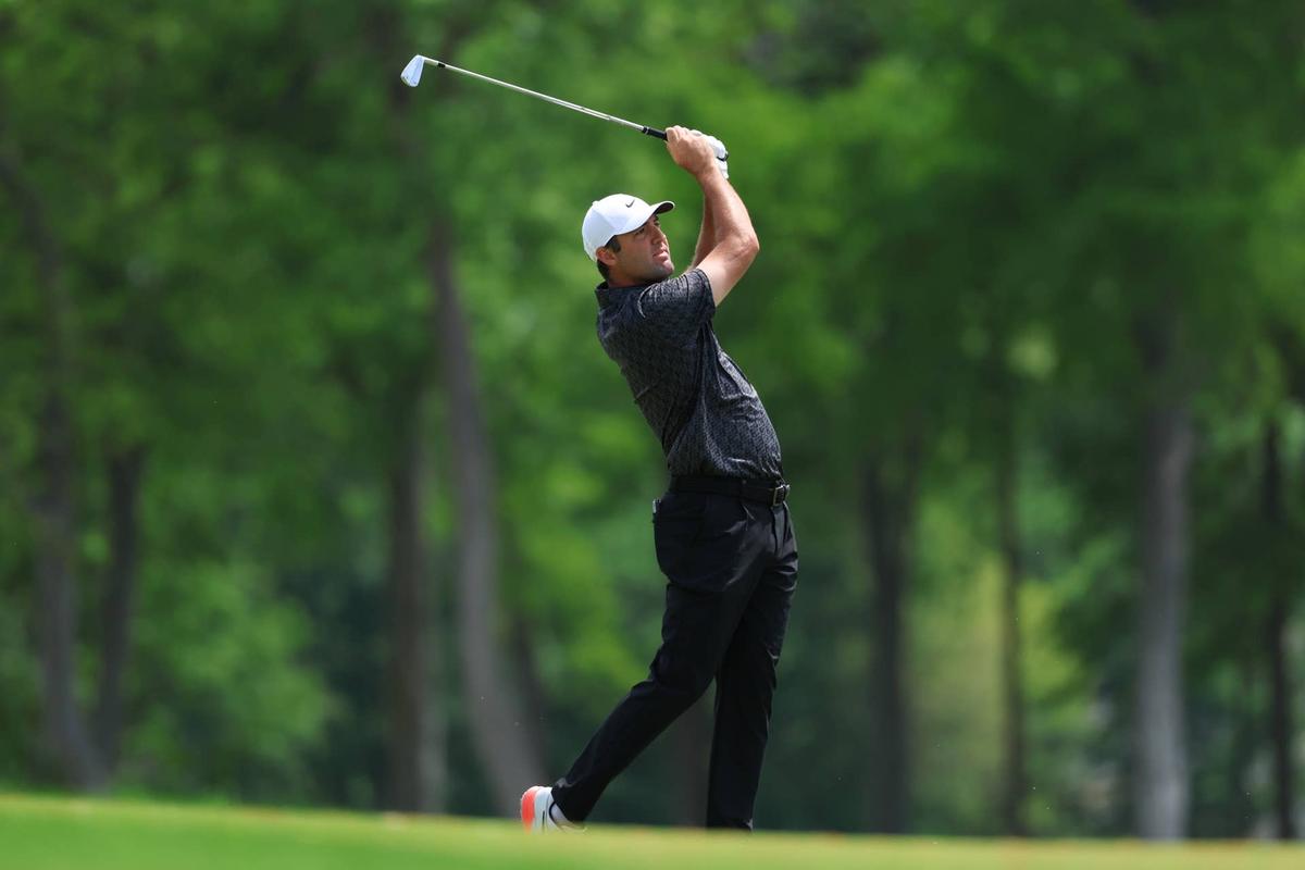  May 13, 2026; Newtown Square, Pennsylvania, USA; Scottie Scheffler plays a shot on the tenth hole during a practice round of the PGA Championship golf tournament at Aronimink Golf Club. Mandatory Credit: Bill Streicher-Imagn Images 