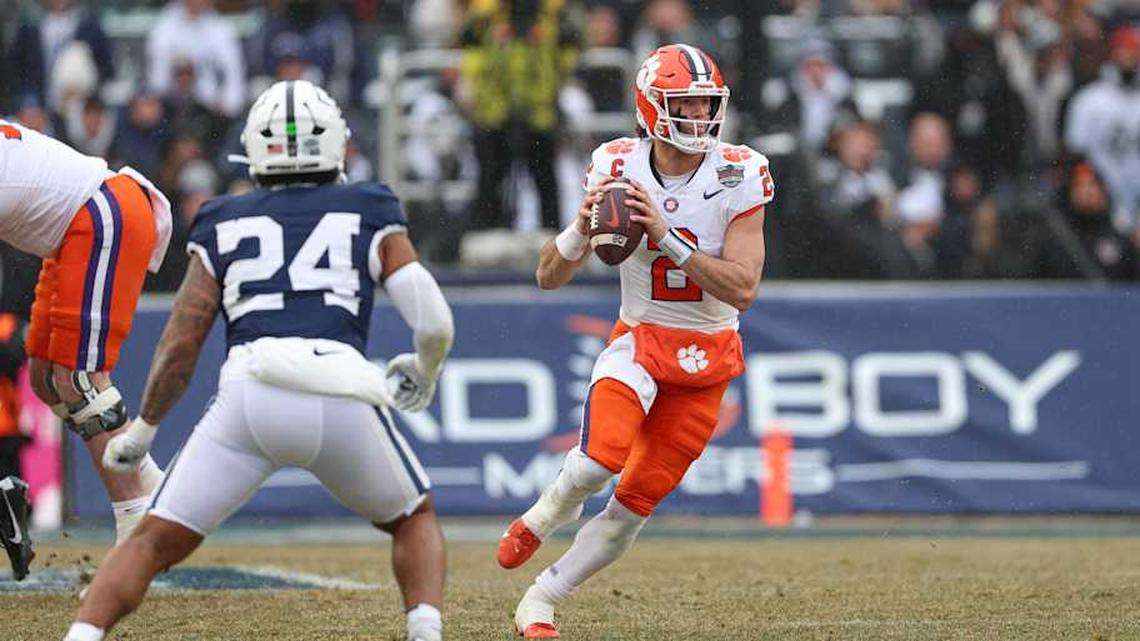  Dec 27, 2025; Bronx, NY, USA; Clemson Tigers quarterback Cade Klubnik (2) scrambles during the first half of the 2025 Pinstripe Bowl in front of Penn State Nittany Lions linebacker Amare Campbell (24) at Yankee Stadium. Mandatory Credit: Vincent Carchietta-Imagn Images | Vincent Carchietta-Imagn Images 
