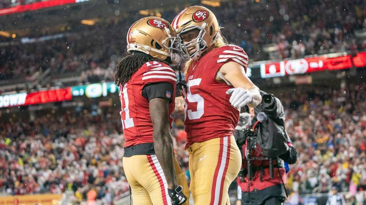  January 20, 2024; Santa Clara, CA, USA; San Francisco 49ers tight end George Kittle (85) is congratulated by wide receiver Brandon Aiyuk (11) after scoring a touchdown during the second quarter in a 2024 NFC divisional round game against the Green Bay Packers at Levi's Stadium. Mandatory Credit: Kyle Terada-Imagn Images | Kyle Terada-Imagn Images 