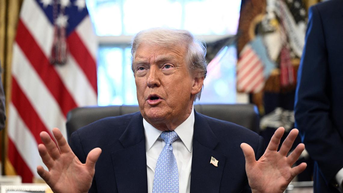 US President Donald Trump speaks during a meeting with the White House Task Force on the FIFA World Cup 2026 in the Oval Office of the White House in Washington, D.C., on Nov. 17, 2025. Currently asylum-seekers must wait six months after filing an asylum request before they can work legally, but the Trump administration is seeking to extend that to one year. The new rule is open for comment until Friday, April 24, 2026. (Brendan Smialowski/AFP via Getty Images/TNS)
