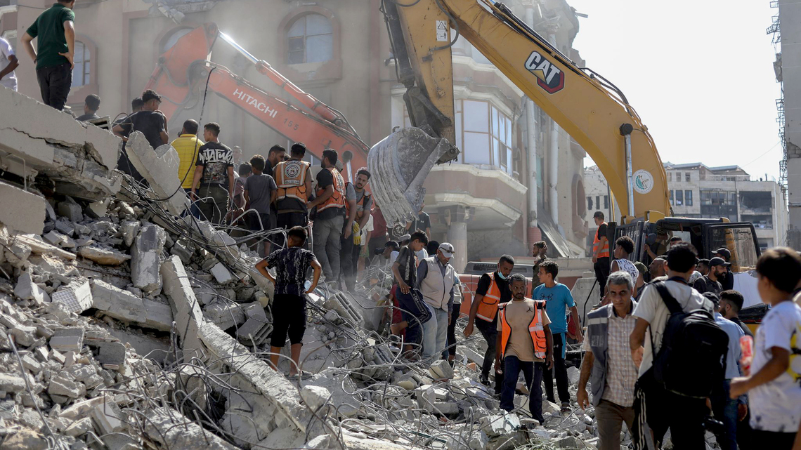 Dozens trapped as Gaza building collapses, killing at least 20 
