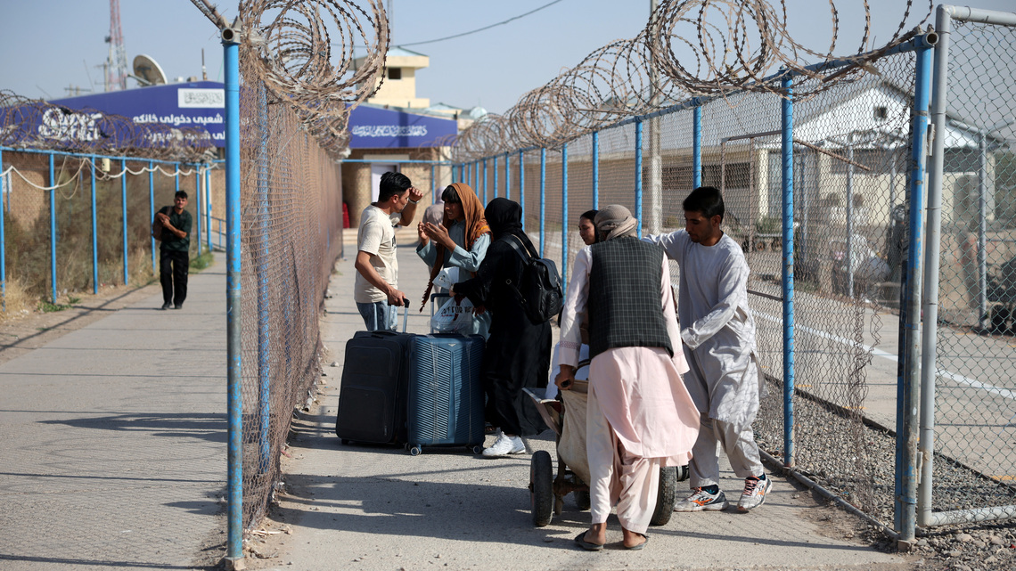 Impoverished by war in Iran, Afghan migrants return to Taliban rule 