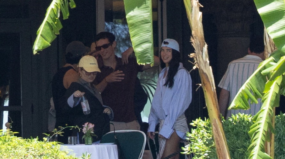 Dua Lipa and Callum Turner stand on the terrace of the restaurant at Grand Hotel Villa Igiea, where the first guests are gathering ahead of the couple's wedding celebrations, in Palermo, Italy, June 4, 2026. REUTERS/Igor Petyx
