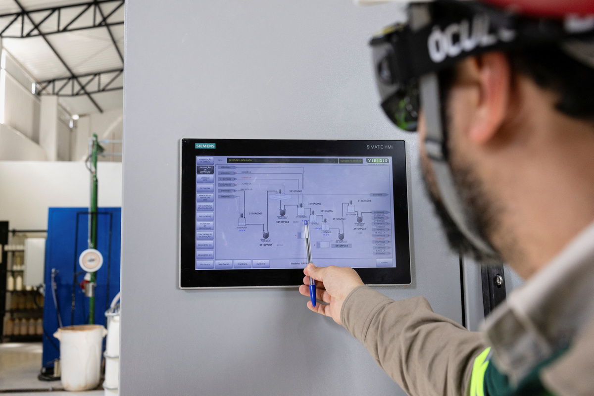 Alessandro dos Reis checks a monitor at the rare earth research and processing center of Australian mining company Viridis Mining and Minerals during a visit of the EU Commissioner for International Partnerships Jozef Sikela, as the European Union is turning to Brazil as a strategic partner in its push to diversify critical mineral supplies, in Pocos de Caldas, Brazil, June 20, 2026. REUTERS/Tuane Fernandes